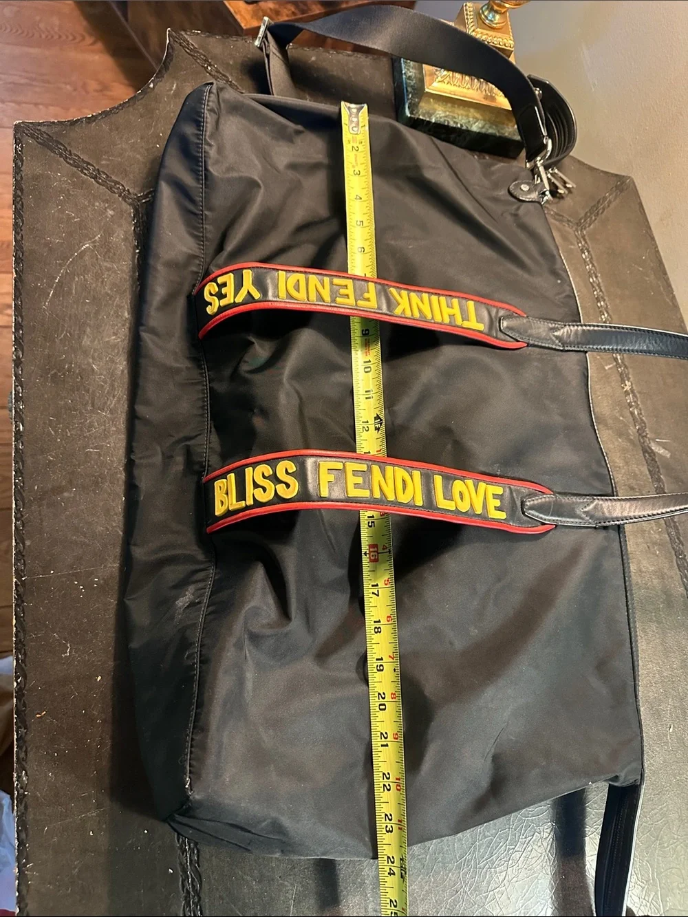 Fendi Black Duffel Bag with Yellow and Red Logo Straps